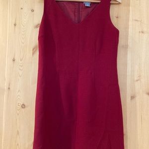 100% virgin wool lined dress with a V neck and back zipper